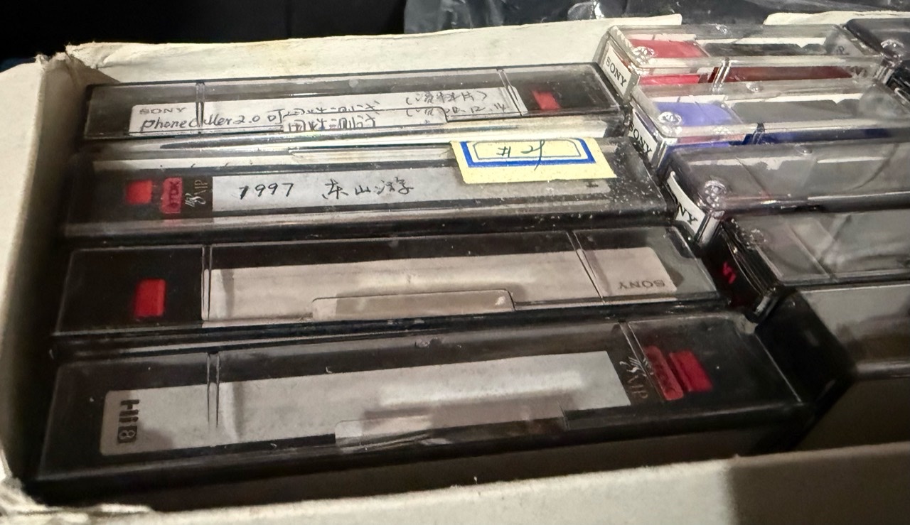 A box of Mini DV tapes kept for decades. One label still says 1997.