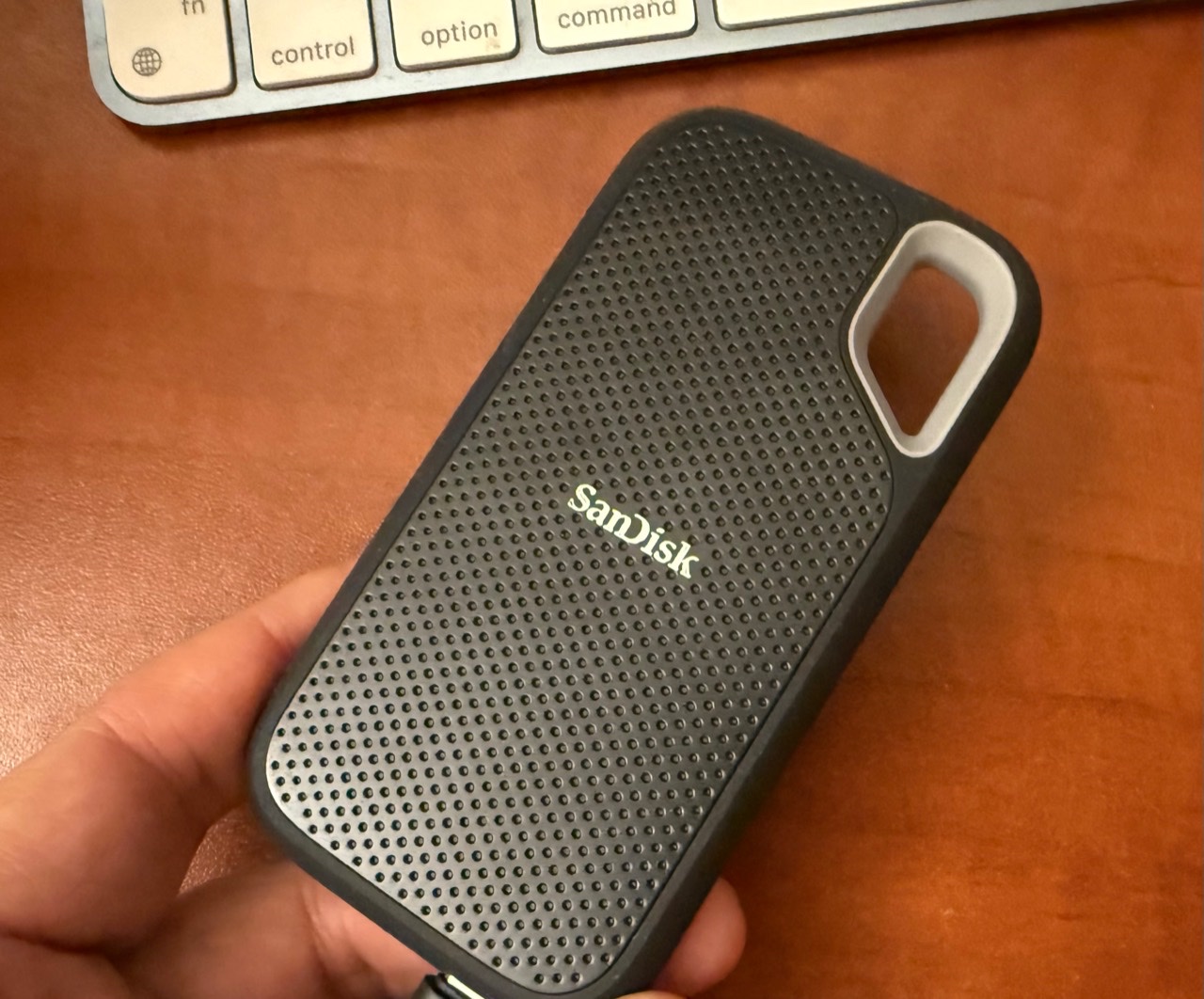 This SanDisk portable SSD looks intact but no longer works. Possessing the device does not make its data reachable.